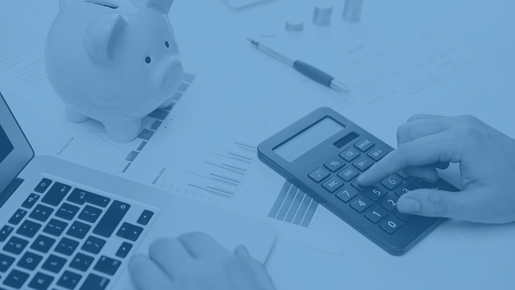 A person planning a budget using a calculator.