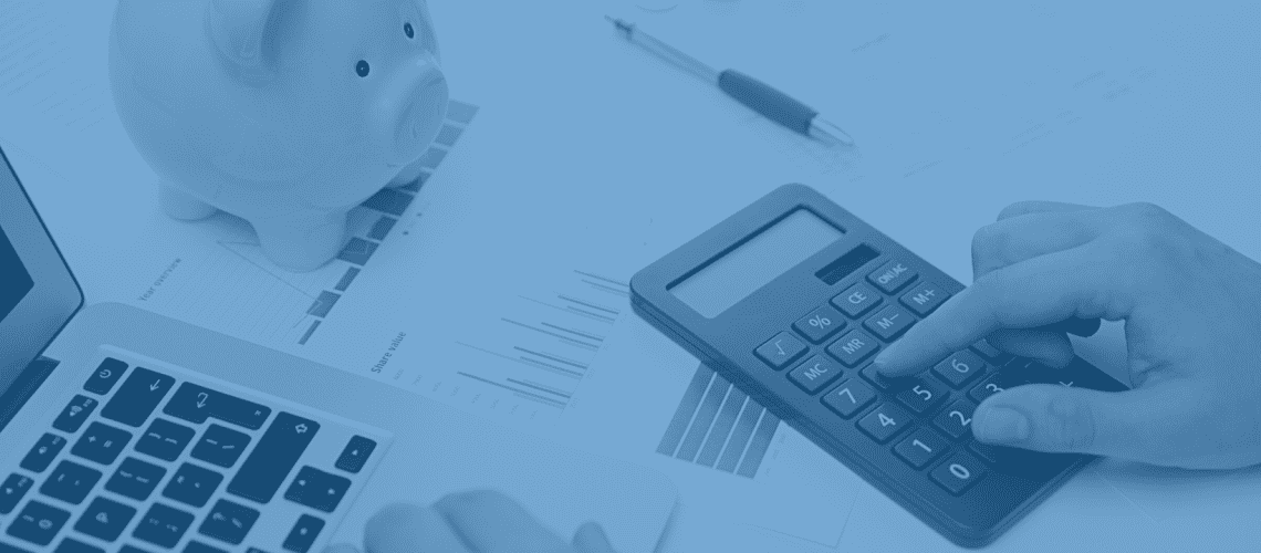 A person planning a budget using a calculator.